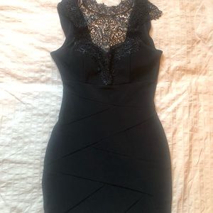 Elegant cocktail dress with elaborate design.